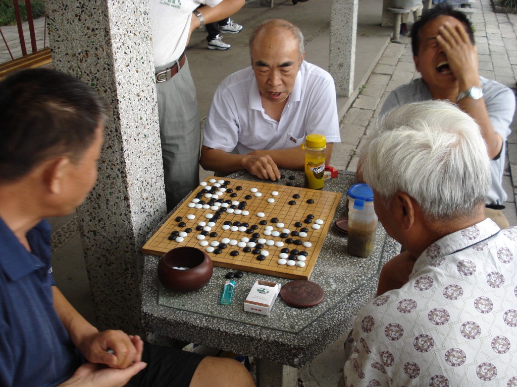 Men playing go - photo by flickr user J.A.G.A.
